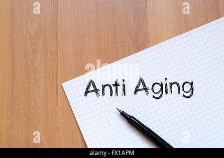 Anti aging text concept write on notebook Stock Photo