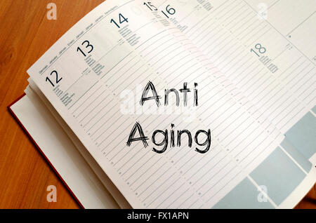 Anti aging text concept write on notebook Stock Photo