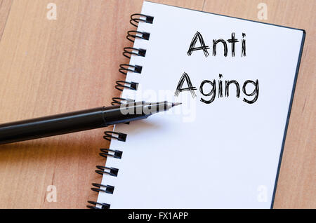 Anti aging text concept write on notebook Stock Photo