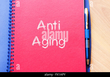 Anti aging text concept write on notebook Stock Photo