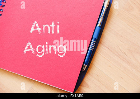 Anti aging text concept write on notebook Stock Photo