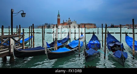 Gondolas in front of San Marco square, Venice, Italy. In the background, San Giorgio Maggiore. Stock Photo