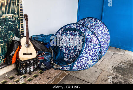 Homeless person sleeping rough in a tent on a pavement, Regent Street, London, England, UK Stock Photo