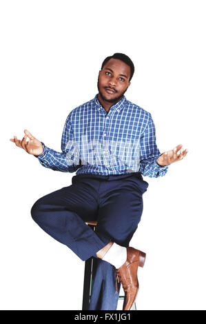 A black young black man sitting isolated for white background showing  with his hand he do's not know. Stock Photo