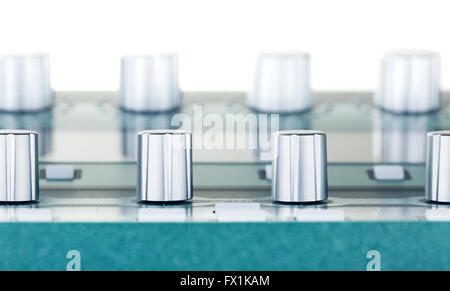 gray amplifier control knobs, close up shot Stock Photo