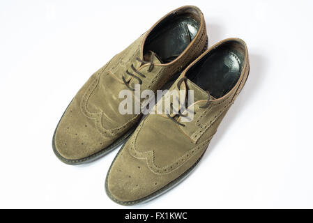 brown used budapester suede shoes on white background Stock Photo