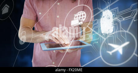 Composite image of mid section of hipster using digital tablet Stock Photo