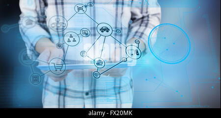 Composite image of casual man using tablet pc Stock Photo