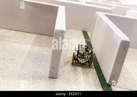Open competition of self-made robots among school students. Robot in a labyrinth. Stock Photo