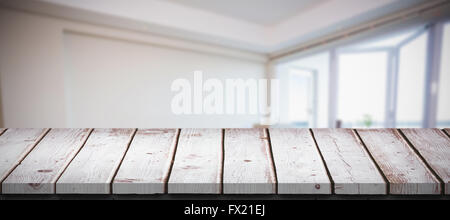 Composite image of cute couple taking a break from unpacking Stock Photo