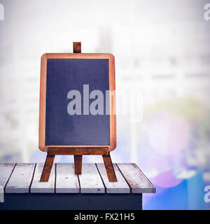 Composite image of computer and colour chart on desk in office Stock Photo