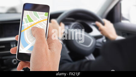 Composite image of cropped hand of man using mobile phone Stock Photo