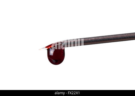 closeup of blood drop from syringe isolated Stock Photo