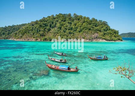 Summer, Travel, Vacation and Holiday concept - Tropical beach, longtail boats at Lipe island in Satun, Thailand Stock Photo