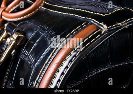 closeup of the fittings on the black leather hand bag Stock Photo