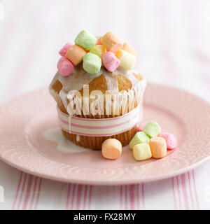 A cupcake with tiny marshmallows on the top. Stock Photo