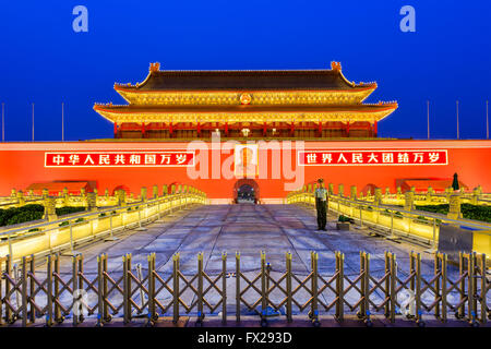 BEIJING, CHINA - JUNE 27, 2014: A soldier guards The Tiananmen Gate at Tiananmen Square. Stock Photo