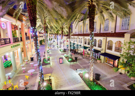 WEST PALM BEACH, FLORIDA - APRIL 3, 2016: Palm trees line CityPlace at night. The mixed-use  development was finished in 2000. Stock Photo