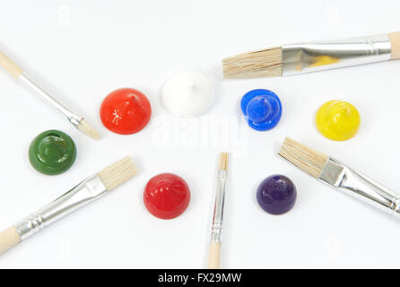 Acrylic colors and paint brushes on a white background Stock Photo