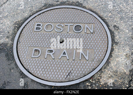 Manhole cover marked Boston Drain Stock Photo