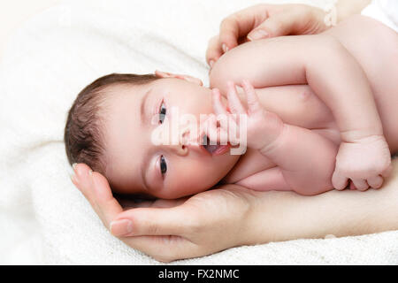 Newborn baby in mother's hands Stock Photo