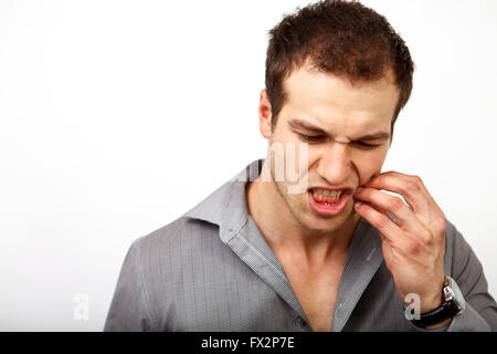Teeth pain concept - man suffering from dental problems Stock Photo