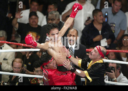 File. 9th Apr, 2016. MANNY PACQUIAO (58-6-2) retires after beating Timothy Bradley by unanimous decision. The Filipino superstar had a 21 year career becoming the first and only eight-division world champion, in which he has won ten world titles, as well as the first to win the lineal championship in four different weight classes. According to Forbes, he was the 2nd highest paid athlete in the world as of 2015. Pictured: Jul 26, 2003; Los Angeles, CA, USA; Boxer Manny Pacquiao celebrates his 3rd TKO win, against Emmanuel Lucero at the Grand Olympic Auditorium. (Credit Image: J.P. Yim/ZUMAP Stock Photo