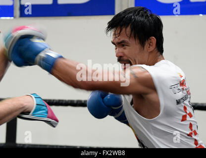 File. 9th Apr, 2016. MANNY PACQUIAO (58-6-2) retires after beating Timothy Bradley by unanimous decision. The Filipino superstar had a 21 year career becoming the first and only eight-division world champion, in which he has won ten world titles, as well as the first to win the lineal championship in four different weight classes. According to Forbes, he was the 2nd highest paid athlete in the world as of 2015. Pictured: April 1, 2016. Hollywood CA. Manny Pacquiao works out with his trainer Freddie Roach on his upcoming fight with Timothy Bradley Wednesday. The two will be fighting each oth Stock Photo