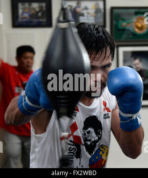 File. 9th Apr, 2016. MANNY PACQUIAO (58-6-2) retires after beating Timothy Bradley by unanimous decision. The Filipino superstar had a 21 year career becoming the first and only eight-division world champion, in which he has won ten world titles, as well as the first to win the lineal championship in four different weight classes. According to Forbes, he was the 2nd highest paid athlete in the world as of 2015. Pictured: April 1, 2016. Hollywood CA. Manny Pacquiao works out with his trainer Freddie Roach on his upcoming fight with Timothy Bradley Wednesday. The two will be fighting each oth Stock Photo