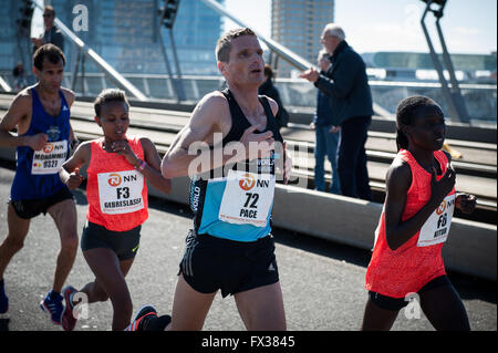 Rotterdam, The Netherlands. 10th Apr, 2016. Participants run on the Erasmus bridge during the Rotterdam Marathon, Kenyan Marius Kipserem won the race in personal best 2 hours, 06 minutes and 10 seconds edging out last year's winner Ethiopian Solomon Deksisa. In the women’s contest, Sutume Asefa Kebede went out fast, covering the first 5km in 16:53, a massive 46 seconds ahead of her pursuers and on 2:18 pace. But disaster struck the leader after 30km when she was hit with stitch. Credit:  Romy Arroyo Fernandez/Alamy Live News Stock Photo