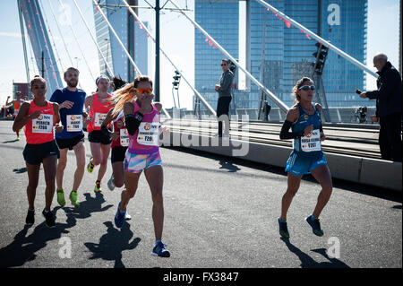 Rotterdam, The Netherlands. 10th Apr, 2016. Participants run on the Erasmus bridge during the Rotterdam Marathon, Kenyan Marius Kipserem won the race in personal best 2 hours, 06 minutes and 10 seconds edging out last year's winner Ethiopian Solomon Deksisa. In the women’s contest, Sutume Asefa Kebede went out fast, covering the first 5km in 16:53, a massive 46 seconds ahead of her pursuers and on 2:18 pace. But disaster struck the leader after 30km when she was hit with stitch. Credit:  Romy Arroyo Fernandez/Alamy Live News Stock Photo