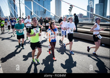 Rotterdam, The Netherlands. 10th Apr, 2016. Participants run on the Erasmus bridge during the Rotterdam Marathon, Kenyan Marius Kipserem won the race in personal best 2 hours, 06 minutes and 10 seconds edging out last year's winner Ethiopian Solomon Deksisa. In the women’s contest, Sutume Asefa Kebede went out fast, covering the first 5km in 16:53, a massive 46 seconds ahead of her pursuers and on 2:18 pace. But disaster struck the leader after 30km when she was hit with stitch. Credit:  Romy Arroyo Fernandez/Alamy Live News Stock Photo