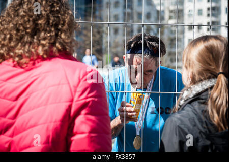 Rotterdam, The Netherlands. 10th Apr, 2016. Participants run on the Erasmus bridge during the Rotterdam Marathon, Kenyan Marius Kipserem won the race in personal best 2 hours, 06 minutes and 10 seconds edging out last year's winner Ethiopian Solomon Deksisa. In the women’s contest, Sutume Asefa Kebede went out fast, covering the first 5km in 16:53, a massive 46 seconds ahead of her pursuers and on 2:18 pace. But disaster struck the leader after 30km when she was hit with stitch. Credit:  Romy Arroyo Fernandez/Alamy Live News Stock Photo