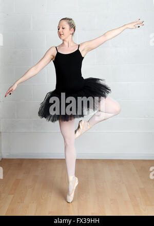 Blonde ballerina in her tutu practicing on her own in the studio, 5th April2016 Stock Photo