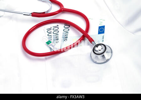 Lab coat with stethoscope and wad of money in the pocket Stock Photo