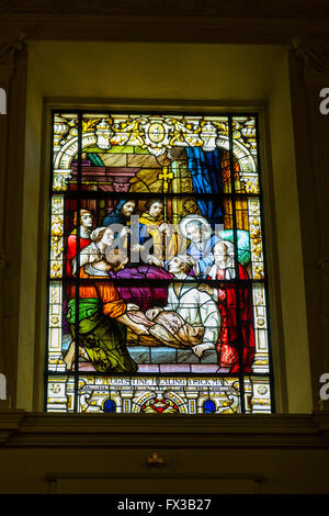 St. Augustine, Florida.  Cathedral Basilica of St. Augustine.  Stained Glass Window showing St. Augustine healing a sick man.