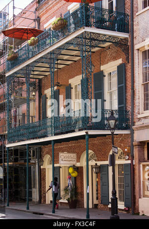 Wrought iron balconies on an old brick French Quarter building.  New Orleans, LA, USA. Stock Photo