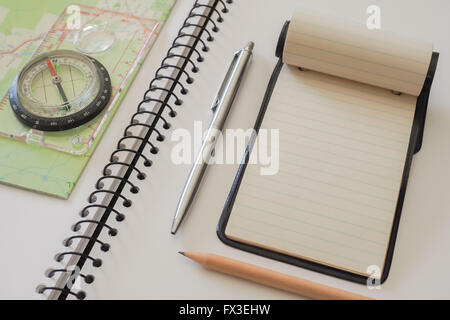 Note Pad with Map and Compass Stock Photo