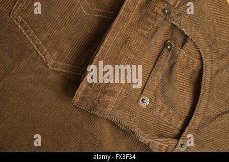Brown bombazine pants close up detail. Fashion, textures and backgrounds Stock Photo