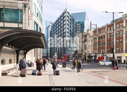 People in Bishopsgate, City of London street scene, looking towards the RBS building, Spitalfields East London UK Stock Photo