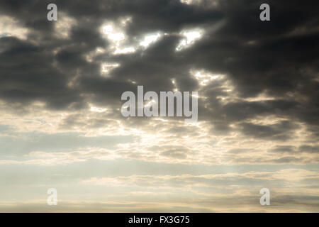 Dynamic clouds with suns rays coming through. Stock Photo