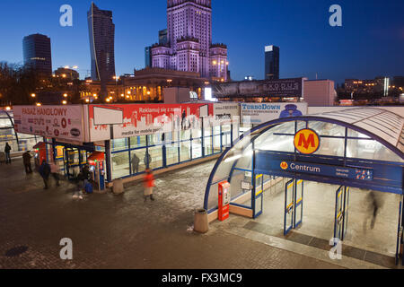 City of Warsaw in Poland by night, entrance - exit to Metro Centrum on line M1 and shopping centre, downtown, subway, tube, unde Stock Photo