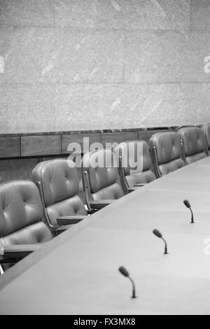 Empty seats at a board room table. Stock Photo