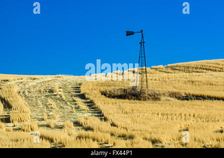 Broken metal windmill once used to pump water on a wheat farm in eastern Washington Stock Photo