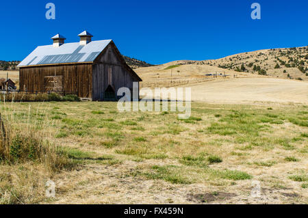 Wooden barn on a ranch in eastern Oregon.  Fossil, Oregon Stock Photo