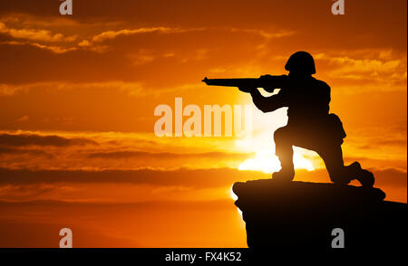 Silhouette of soldier on the edge. Element of design. Stock Photo