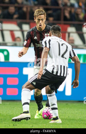 Milan, Italy. 9th Apr, 2016. Keisuke Honda (Milan), Alex Sandro (Juventus) Football/Soccer : Italian 'Serie A' match between AC Milan 1-2 Juventus at Stadio Giuseppe Meazza in Milan, Italy . © Enrico Calderoni/AFLO SPORT/Alamy Live News Stock Photo