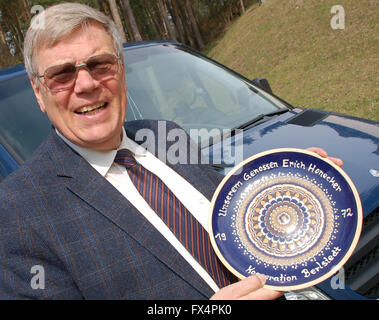 Drewitz, Germany. 10th Apr, 2016. Former bodyguard Bernd Brueckner holds up a souvenir from his time as the bodyguard of GDR Head of State Erich Honecker in Drewitz, Germany, 10 April 2016. For 13 years, the 67 year old was the commando leader of the protection force for the Socialist Unity Party leader. Photo: WINFRIED WAGNER/dpa/Alamy Live News Stock Photo