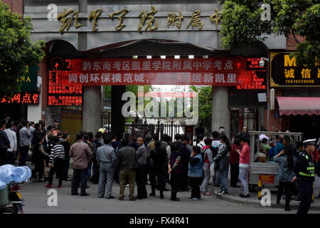 Qiandongnan. 11th Apr, 2016. Parents wait outside the school gate after a wall collapsed at the Affiliated High School of Kaili University in Kaili City, Qiandongnan Miao and Dong Autonomous Prefecture, southwest China's Guizhou Province, April 11, 2016. One student was killed and four others were injured in the accident. Credit:  Xinhua/Alamy Live News Stock Photo