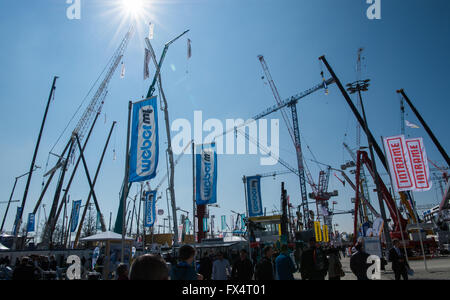 Munich, Germany. 11th Apr, 2016. Cranes in various configurations and heights can be seen at the opening of Bauma, the world's largest construction fair, in Munich, Germany, 11 April 2016. Photo: PETER KNEFFEL/dpa/Alamy Live News Stock Photo